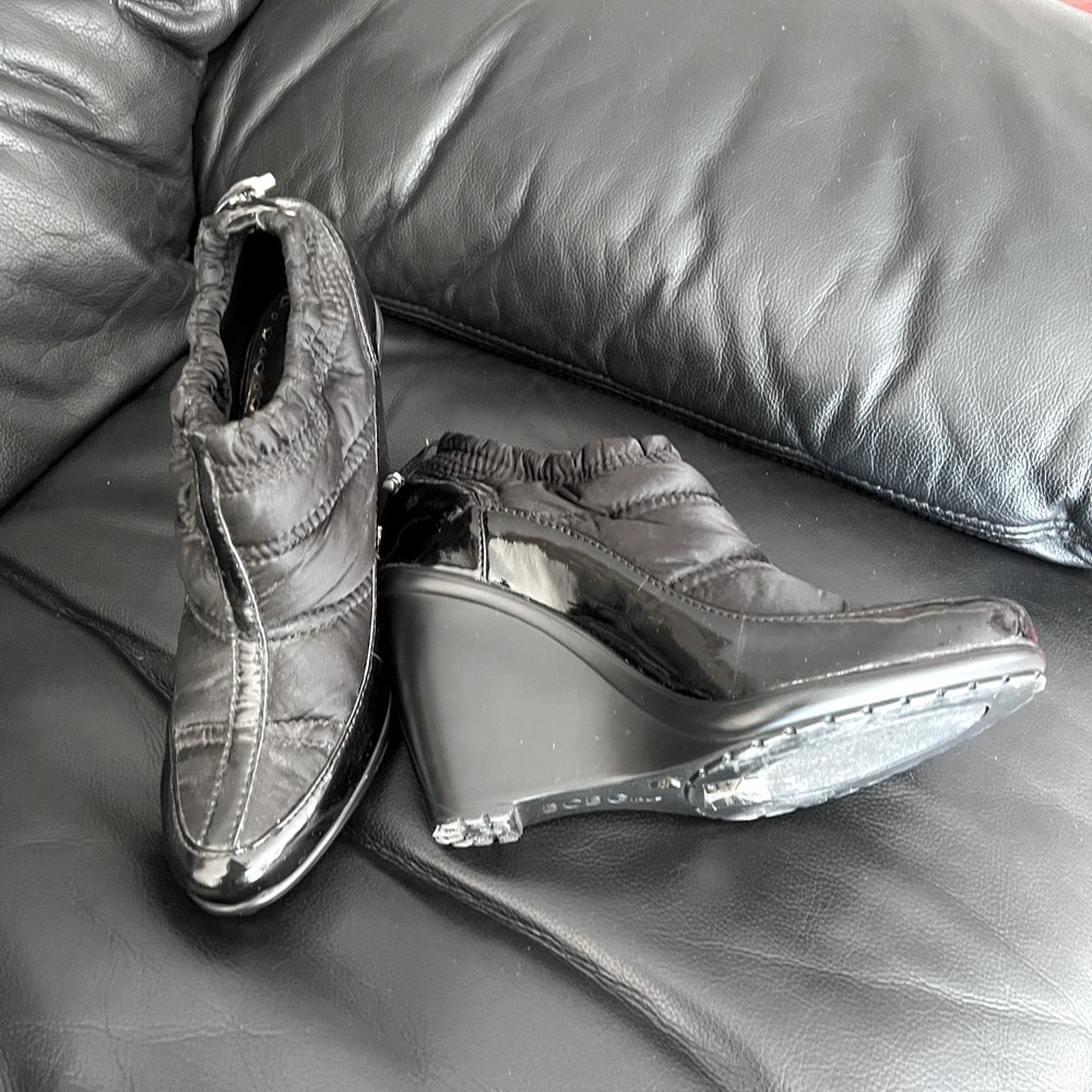 Black ankle boots by BCBG, upper trimmings leather , man made sole